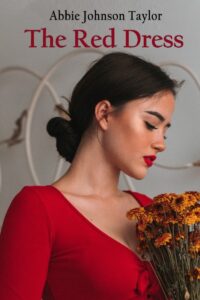 The front cover image features the profile of a woman with olive skin, red lips, dark hair, and dark eyebrows. Her hair is styled in a low bun. She is wearing a low cut red dress that is bunched in the bust. Her collarbone is prominent and her neck is long. She is holding a bouquet of dried orange Calendula flowers. Behind her are some large white rings hanging on a white wall. At the top of the image is the Author’s name and the title of the book.